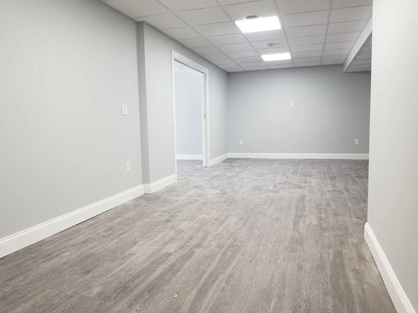 Bright finished basement with recessed lights