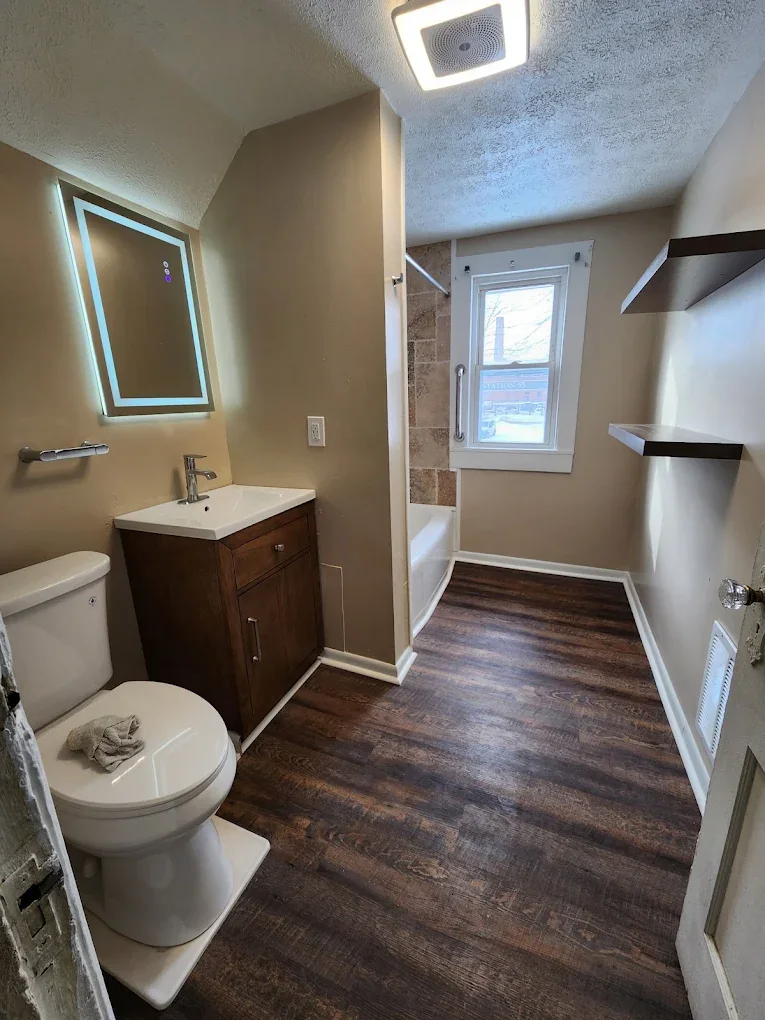 Updated bathroom with wood-look floor