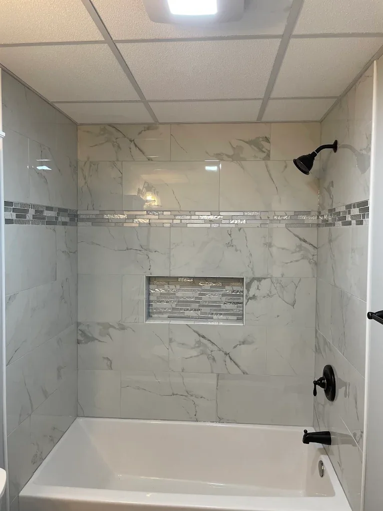 Remodeled glass shower with stone-look tile